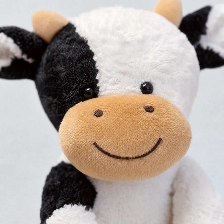 Cow Plush Toy with Smiling Face and Soft Fur - Détail matière
