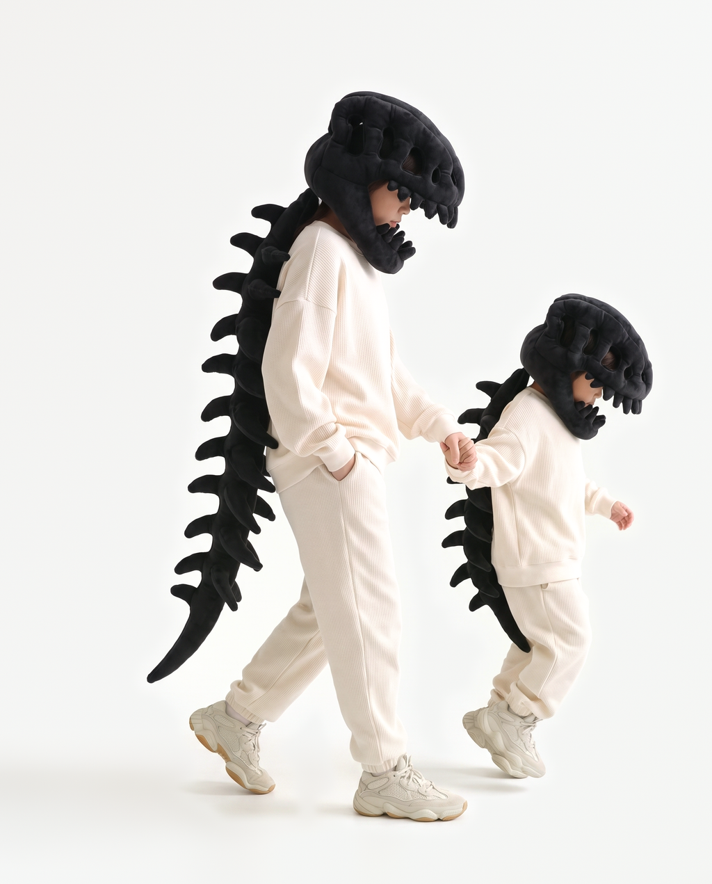 Black Dinosaur Skeleton Costume, two people in matching costumes walking