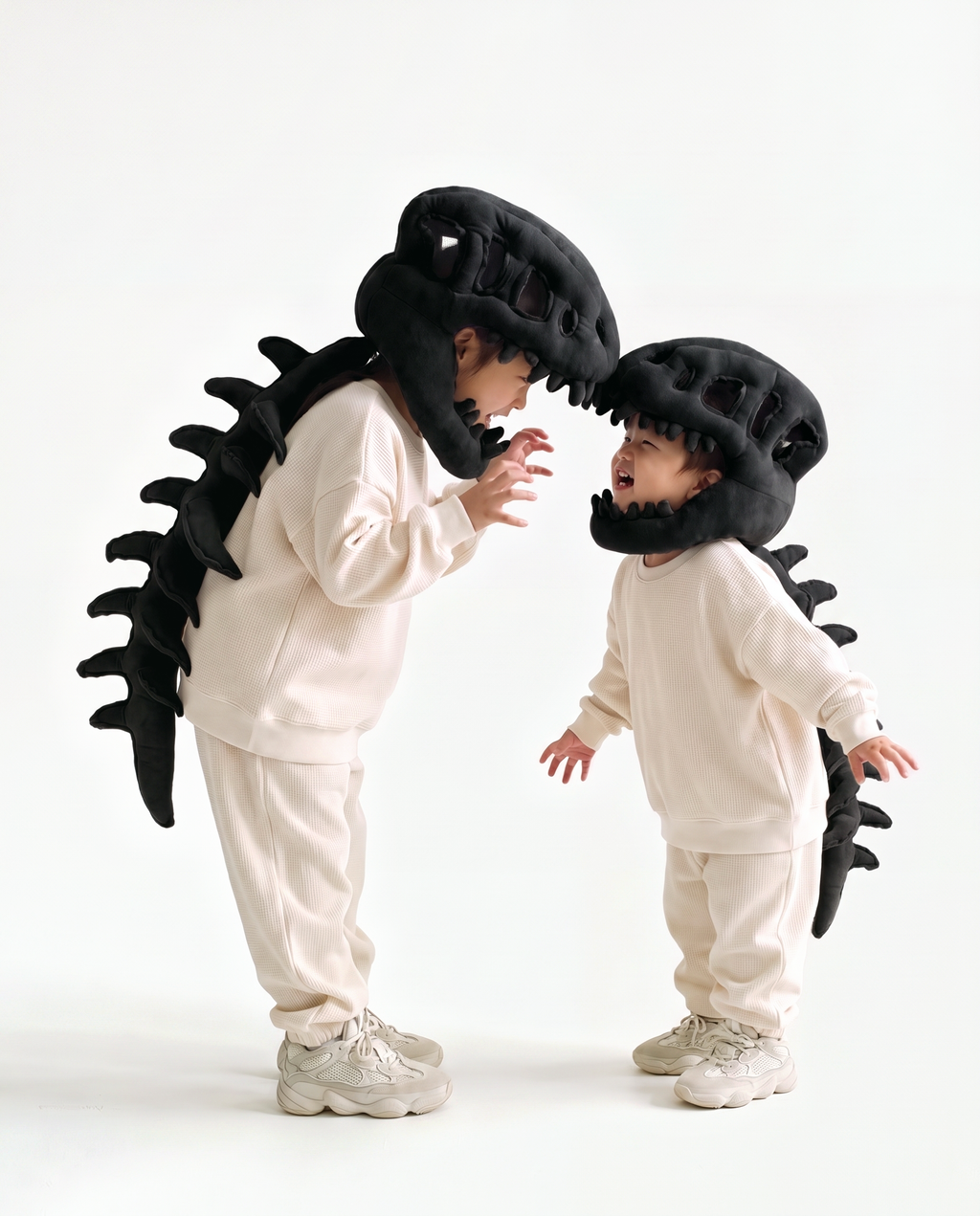 Black Dinosaur Skeleton Costume, two people in matching costumes face to face