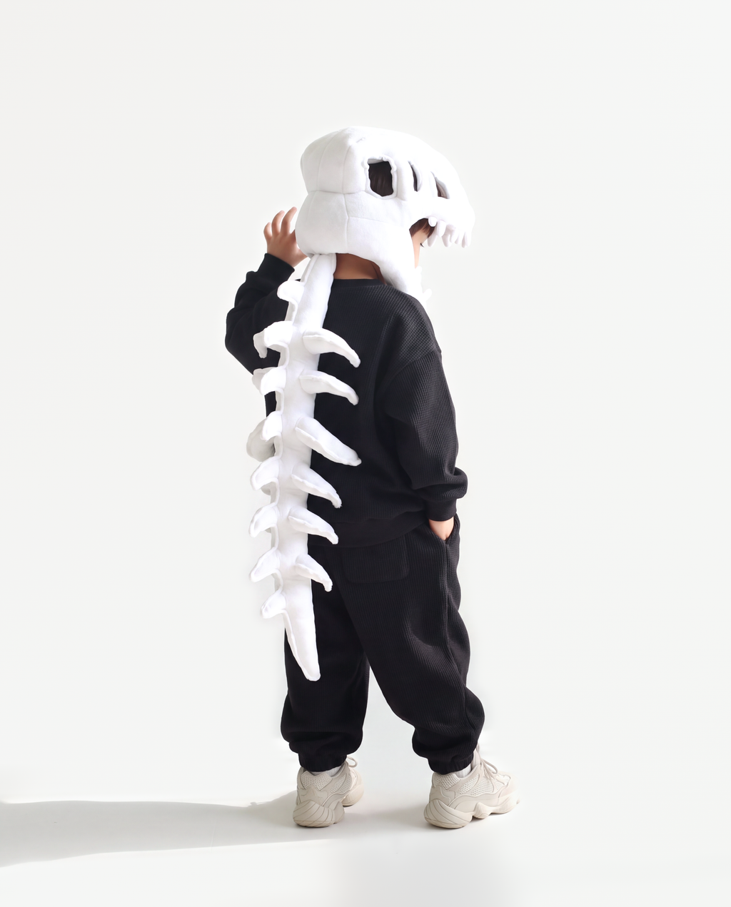 Bone Dinosaur Skeleton Costume, side view hand on hood