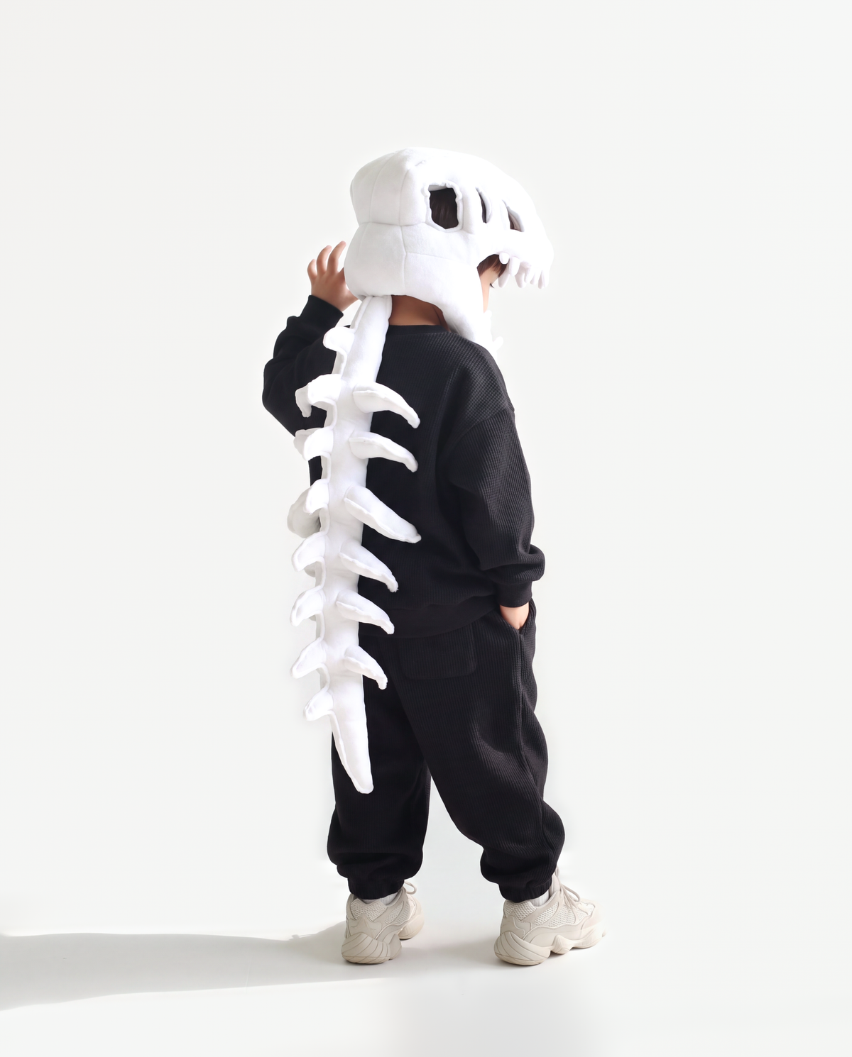 Bone Dinosaur Skeleton Costume, side view hand on hood