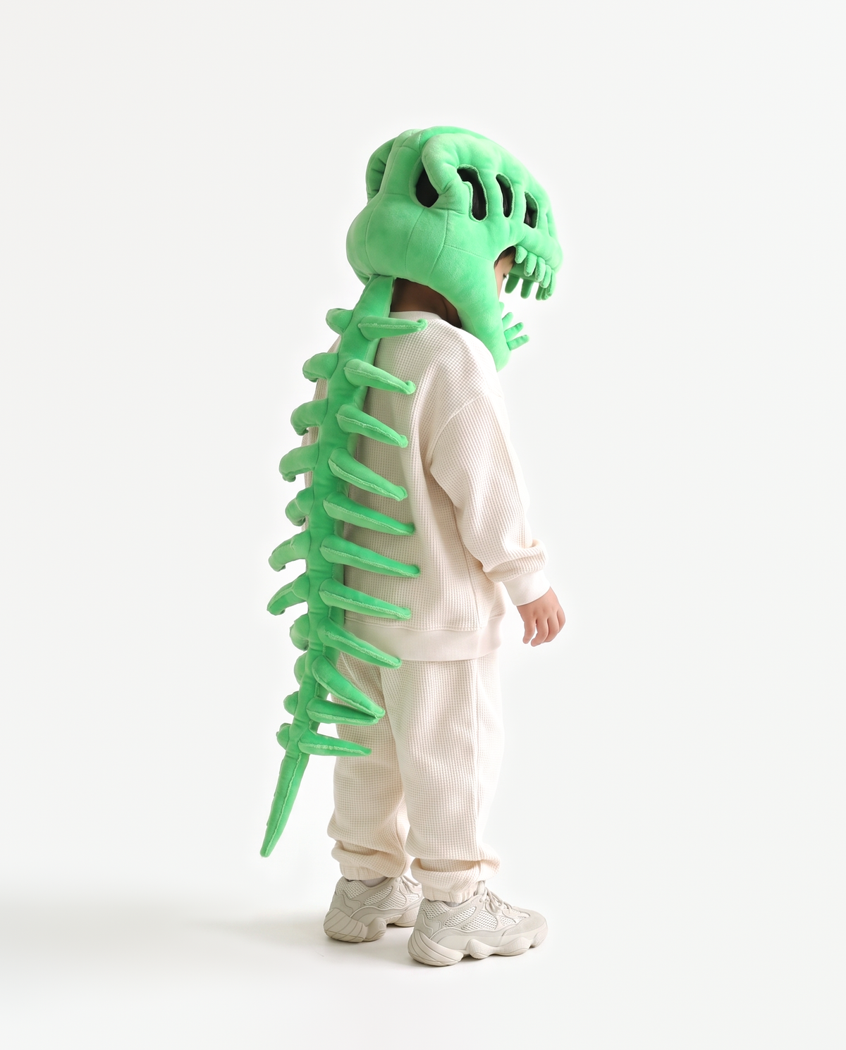 Green Dinosaur Skeleton Costume, side view hand on hood