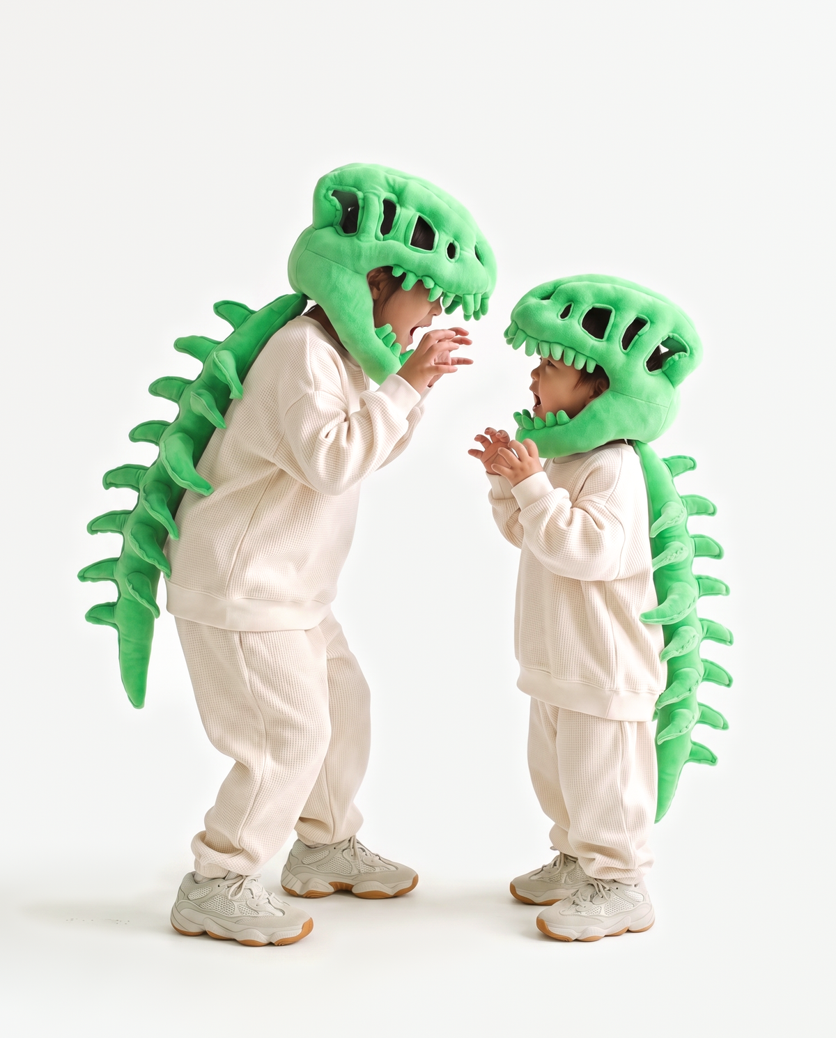 Green Dinosaur Skeleton Costume, two people in matching costumes face to face