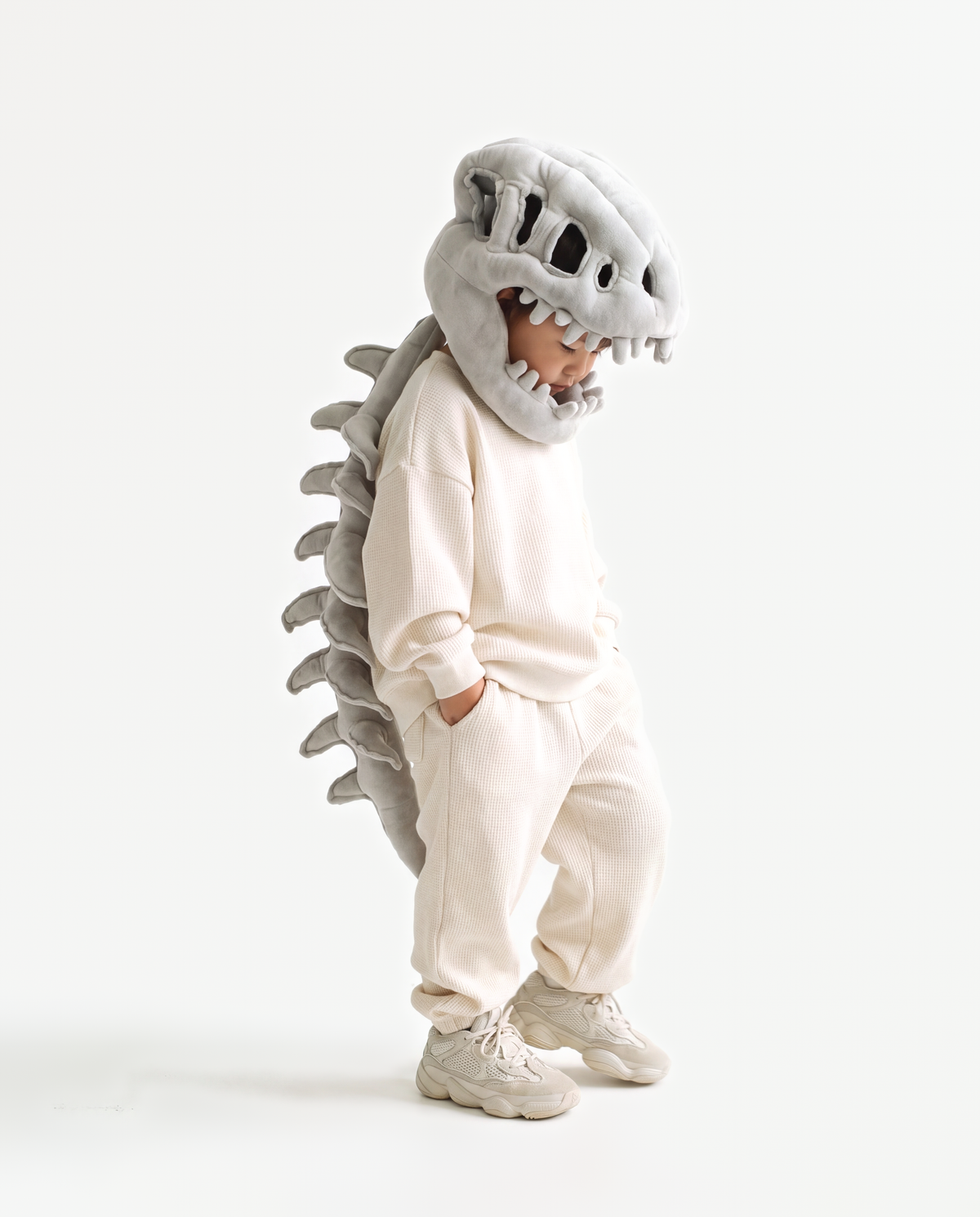 Grey Dinosaur Skeleton Costume, side view hand on hood