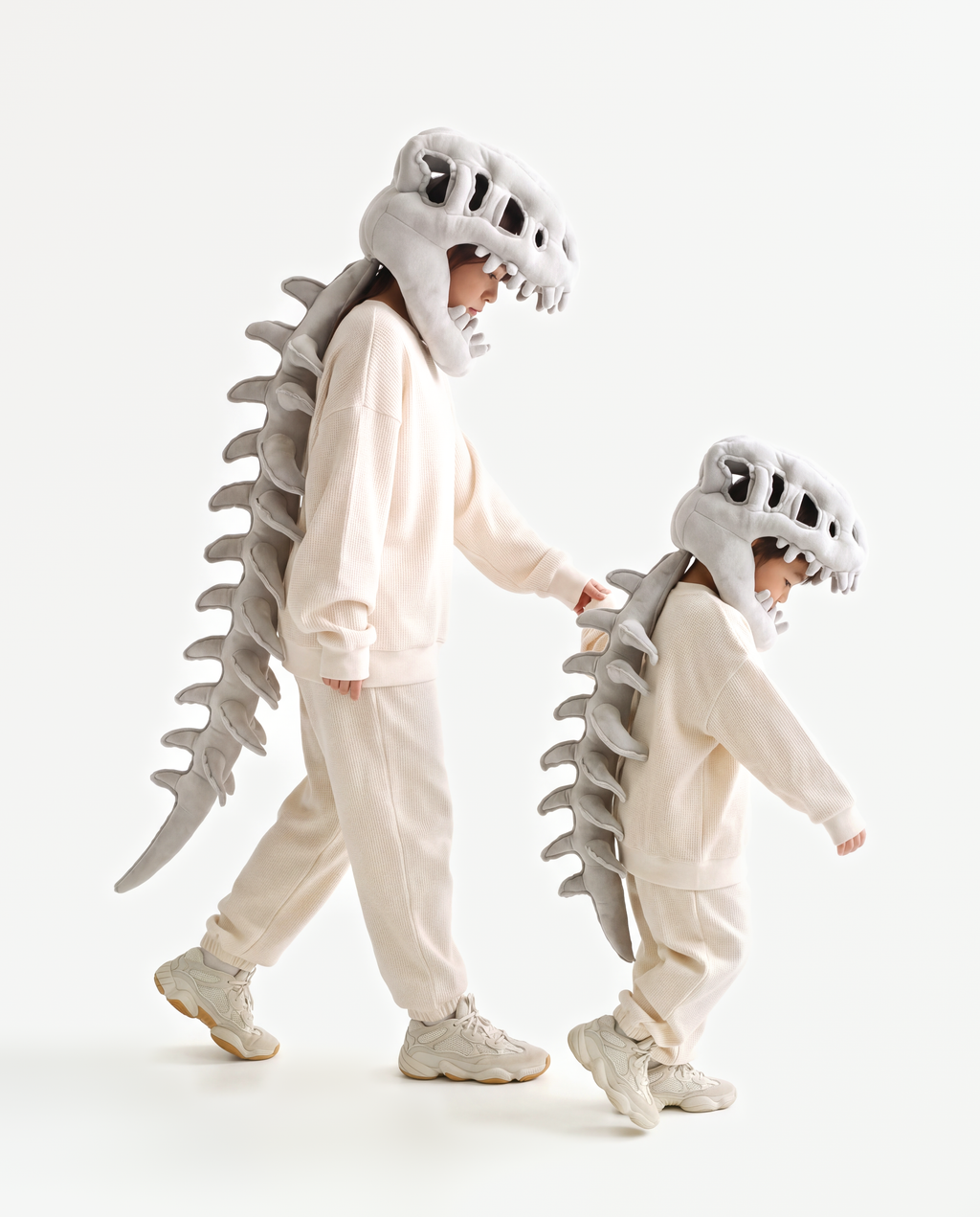 Grey Dinosaur Skeleton Costume, two people in matching costumes walking
