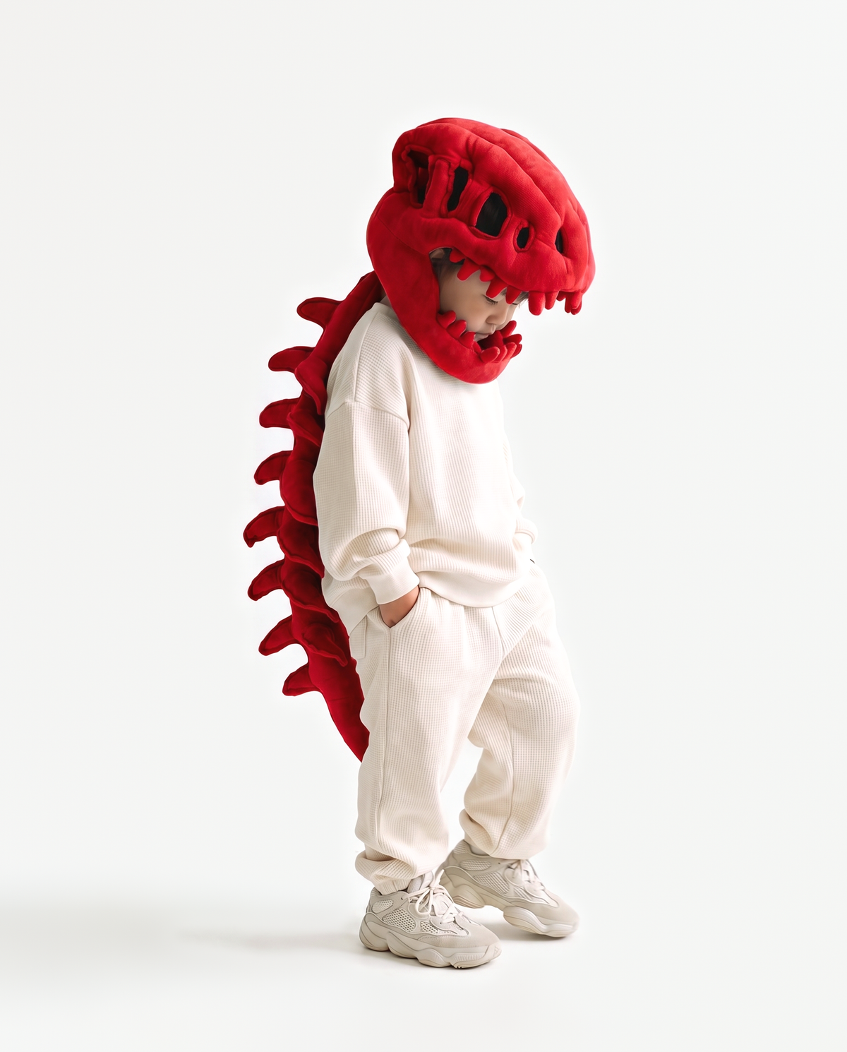 Red Dinosaur Skeleton Costume, side view hand on hood