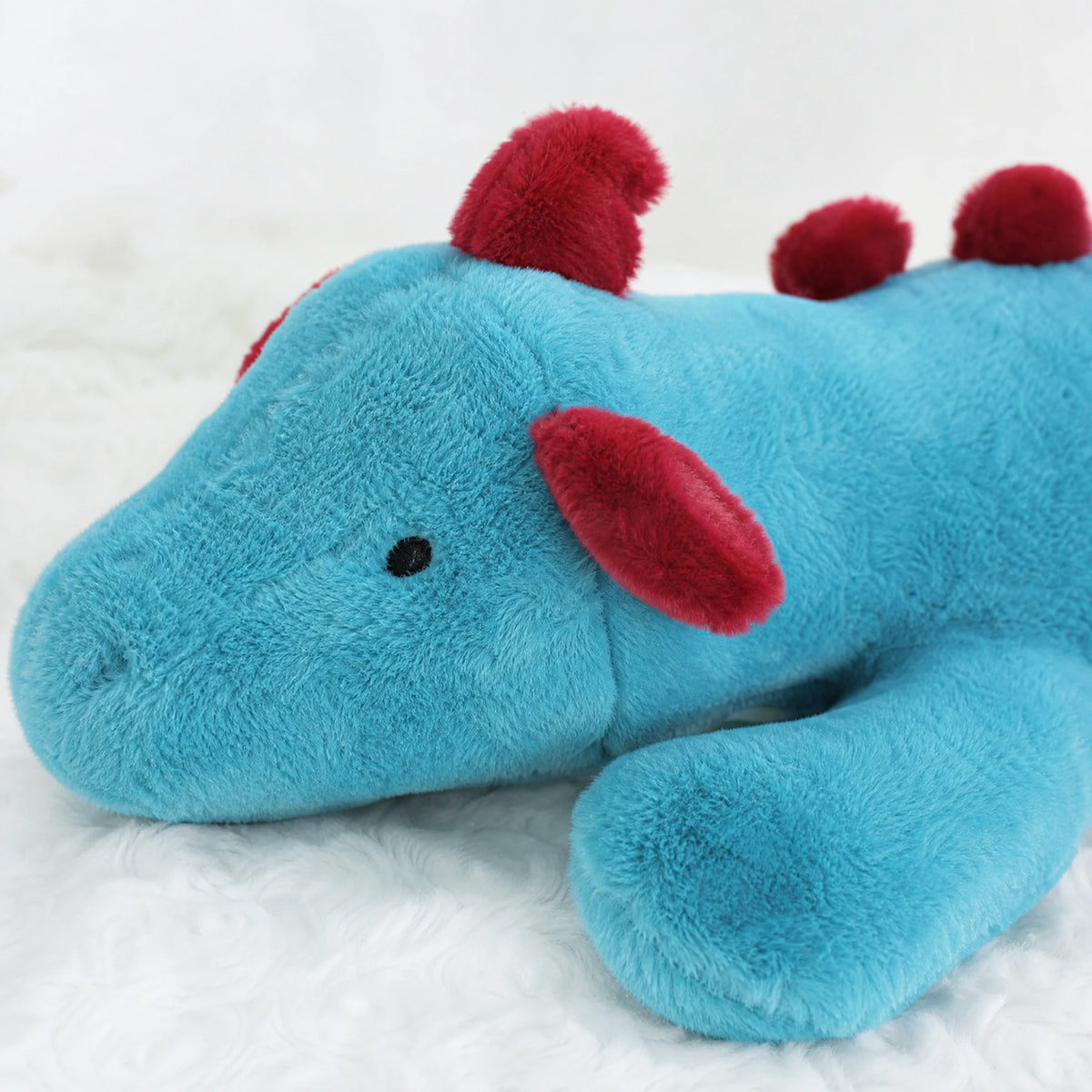 Dragon Plush Pillow with Turquoise Body and Red Spikes - Détail matière