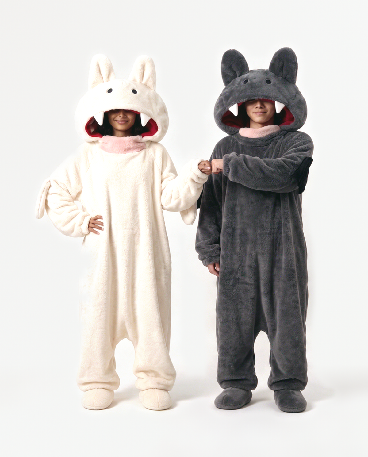 Cream and Charcoal Fang Monster Onesie, two people in matching costumes standing