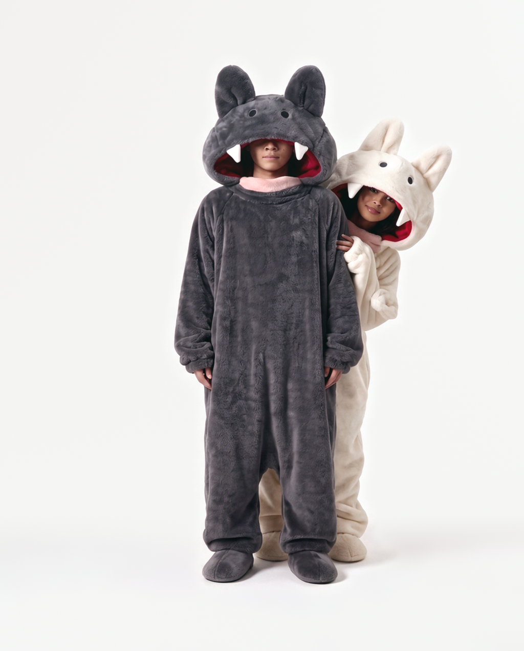 Cream and Charcoal Fang Monster Onesie, two people in matching costumes arm around the shoulders