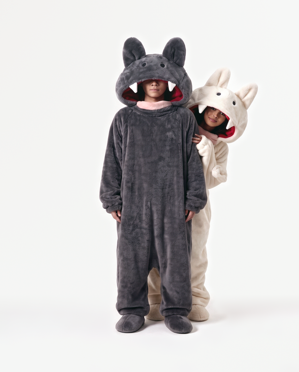 Cream and Charcoal Fang Monster Onesie, two people in matching costumes arm around the shoulders