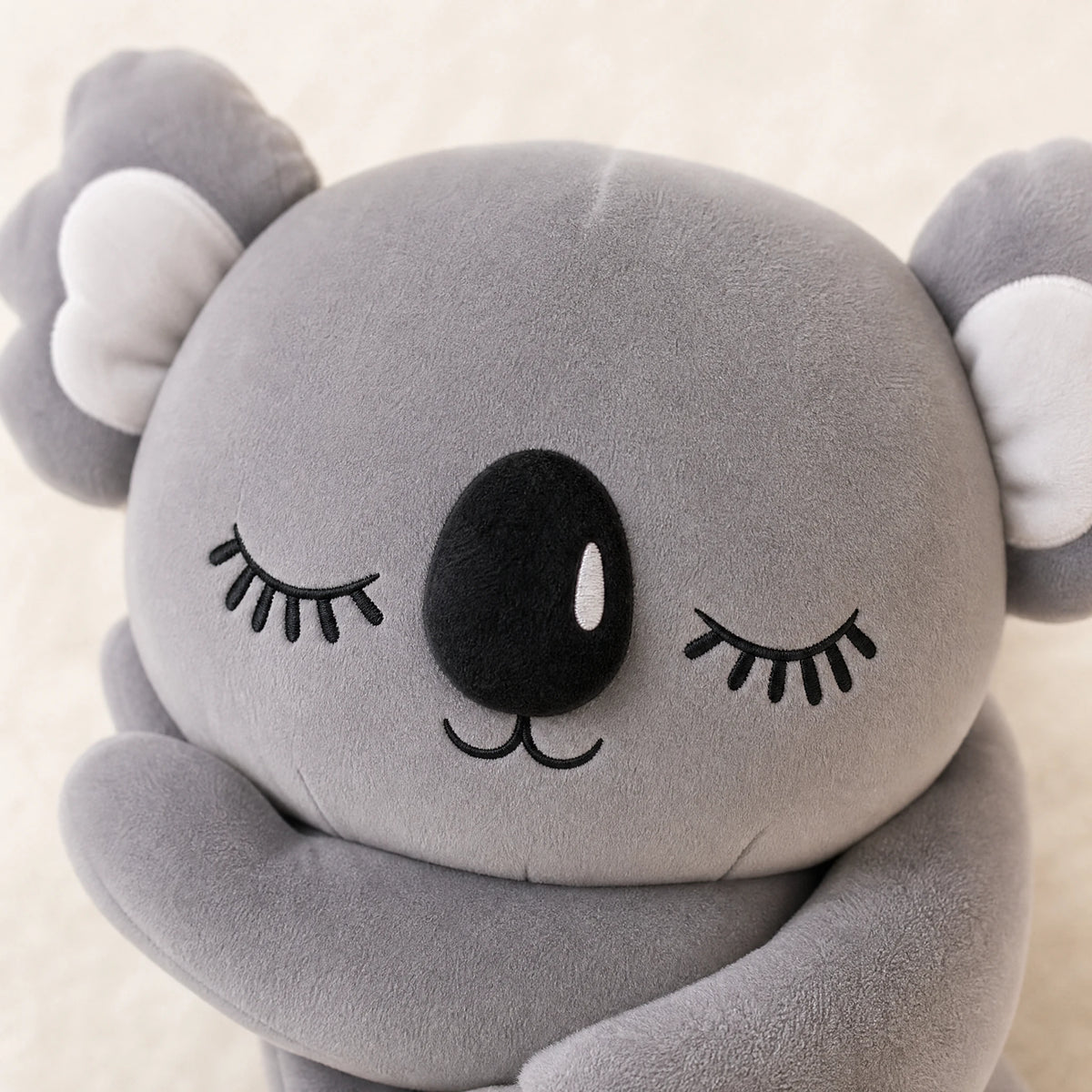 Koala Plush Toy with Closed Eyes and Cuddly Design - Détail matière