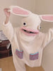Person in the Marshmallow Bunny Onesie dancing with the floppy ears up