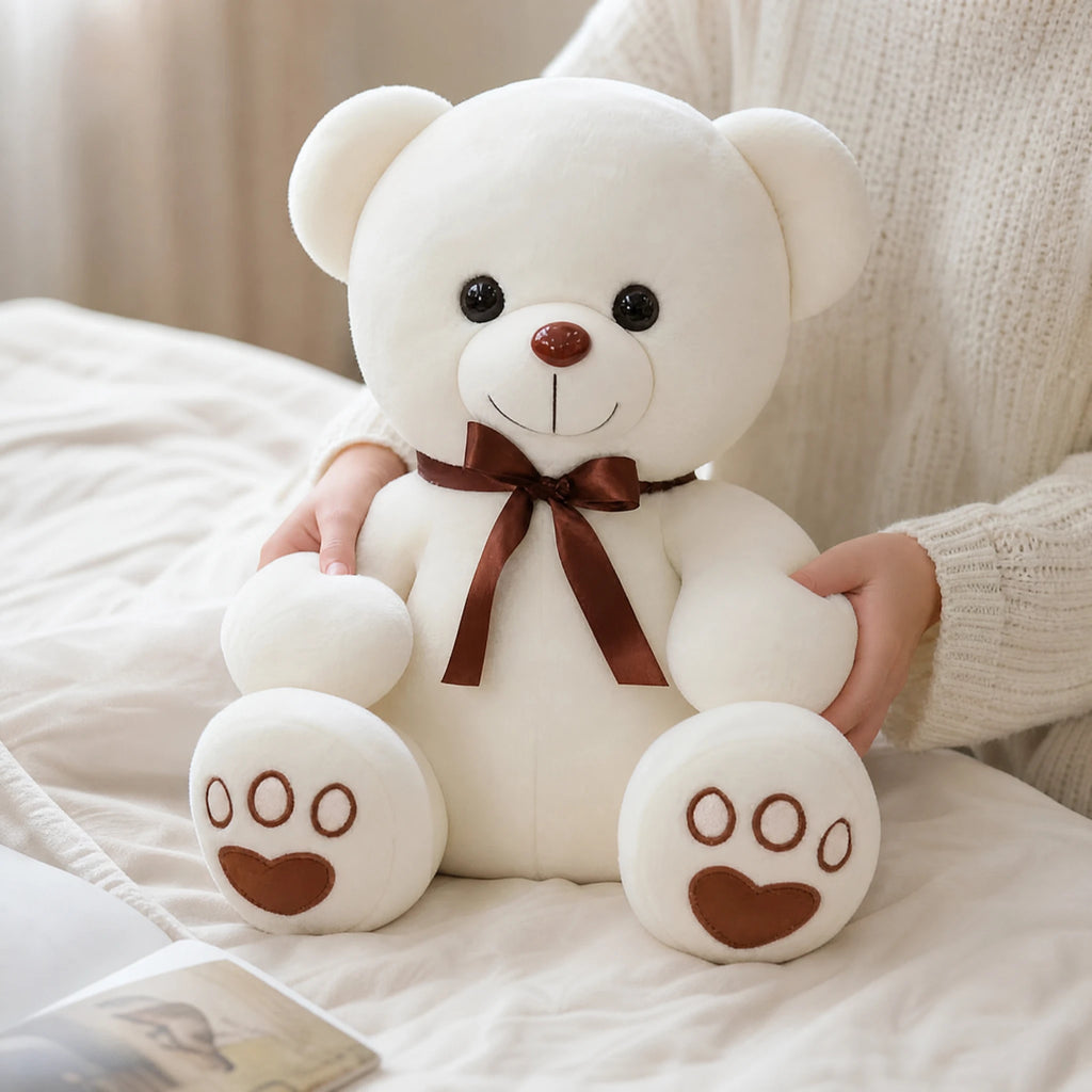 White Teddy Bear Plush with Brown Bow and Paw Prints - Utilisation du produit